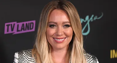 A person with long blonde hair smiling at a TV Land event.