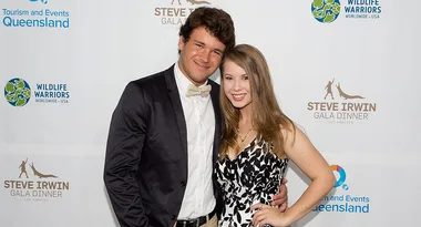 Man in a black suit and woman in a black and white dress at the Steve Irwin Gala Dinner.