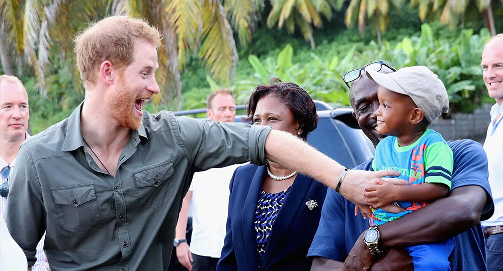 Prince Harry meets a young boy called Jyasi Junior as he visits a Turtle Conservation Project on the seventh day of an official visit to the Caribbean on November 26, 2016 in Colonarie, Saint Vincent and the Grenadines.