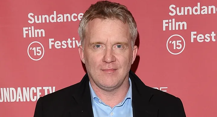 Man in black jacket at Sundance Film Festival 2015 red carpet backdrop.
