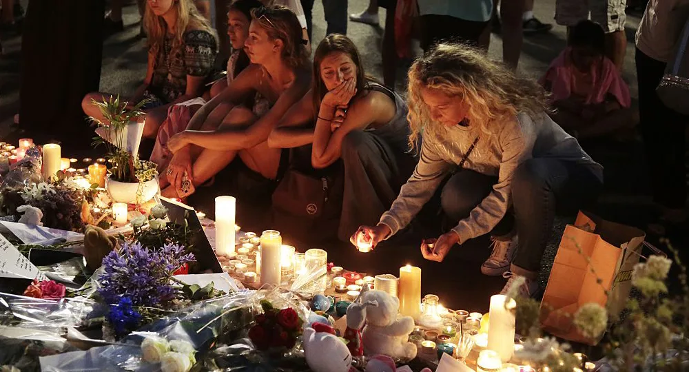 People mourn for the Nice, France victims.