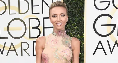 ```html
<img src="https://dumkhum.com/wp-content/uploads/2018/01/Giuliana-Rancic-1.jpg" alt="Person in floral dress at Golden Globe Awards." />
```