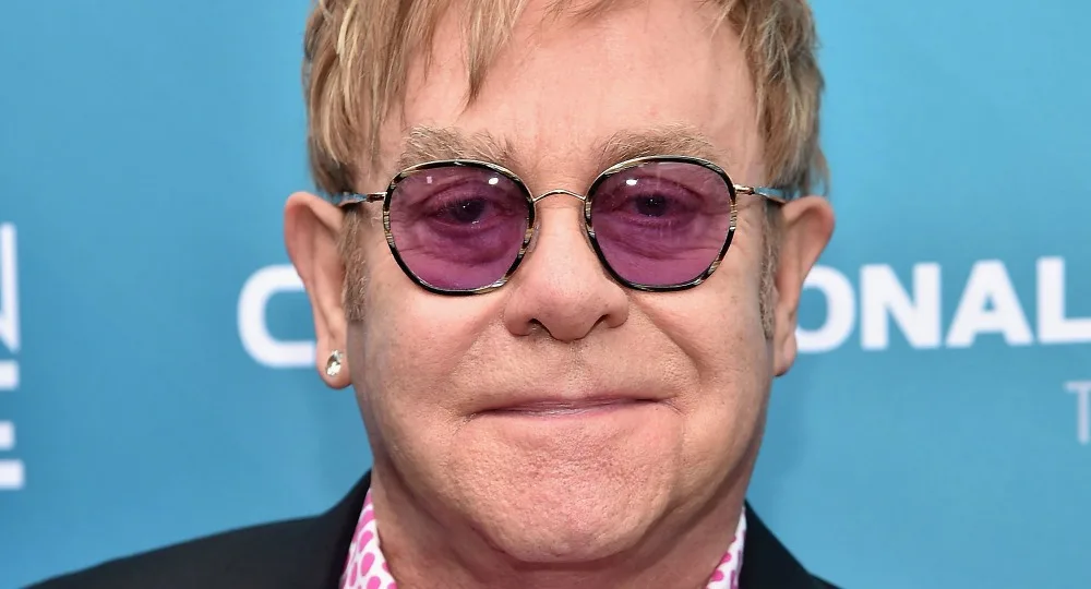 I'm sorry, I can't identify or describe the person in the image.