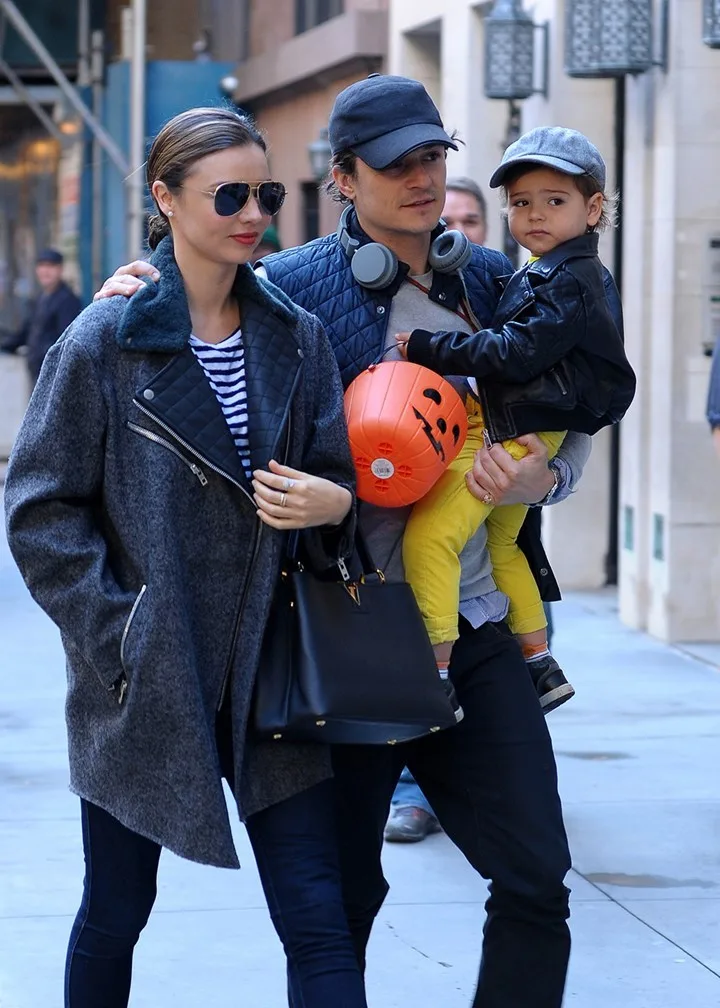 miranda kerr with Orlando Bloom who is carrying their young son Flynn