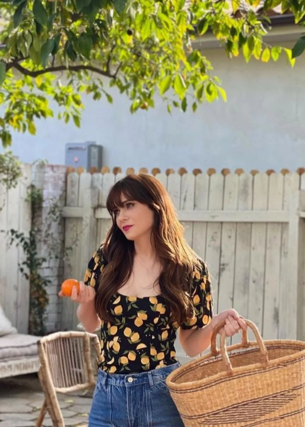 zooey-deschanel-holding-orange