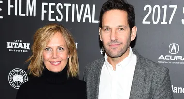 A woman and a man smiling at the Sundance Film Festival 2017 event backdrop.