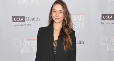 A woman with long hair in a black outfit at the UCLA Visionary Ball 2016.