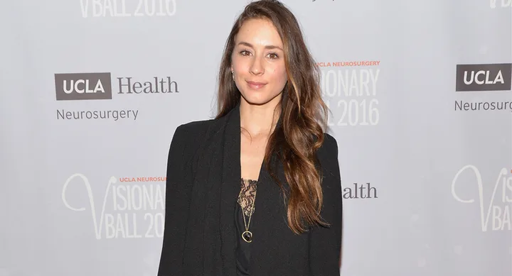 A woman with long hair in a black outfit at the UCLA Visionary Ball 2016.