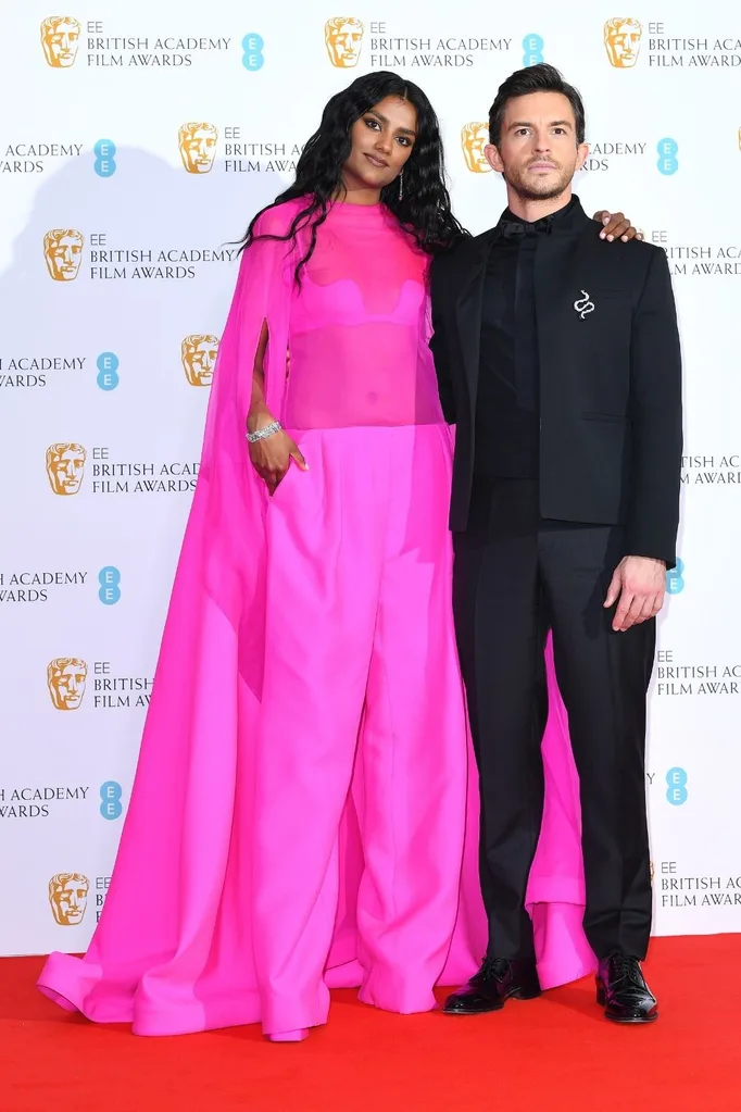 Simone Ashley wears Valentino and Jonathan Bailey wears Dior at the 2022 BAFTAs.