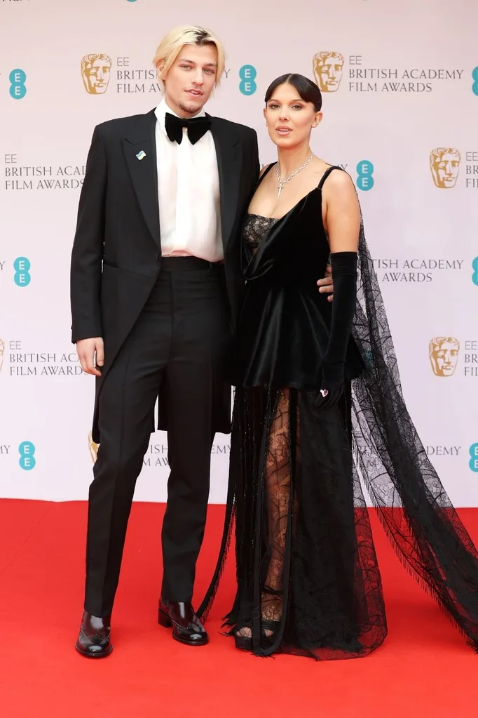 Millie Bobby Brown wears Louis Vuitton and Jake Bongiovi wears Fendi at the 2022 BAFTAs.