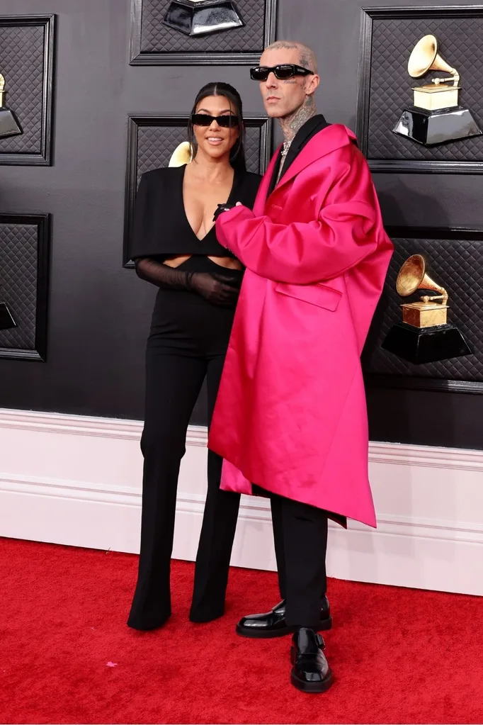 Kourtney Kardashian and Travis Barker attend the 2022 Grammy Awards.