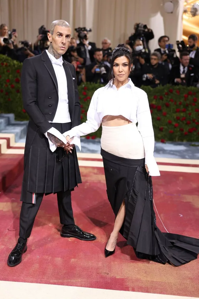 Kourtney Kardashian and Travis Barker at the 2022 Met Gala wearing Thom Browne