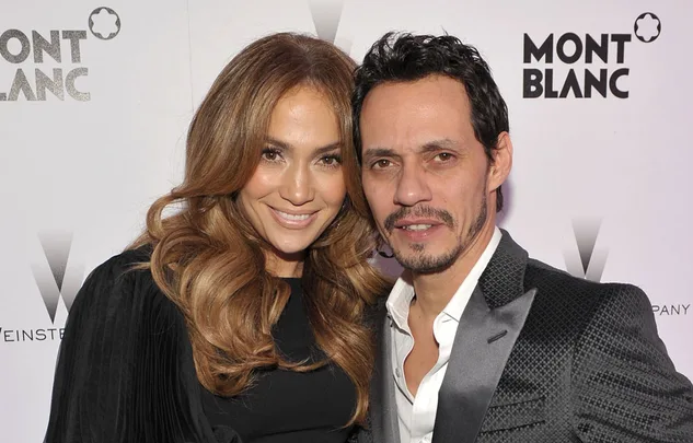 Two people posing together at an event with Montblanc and Weinstein logos in the background.