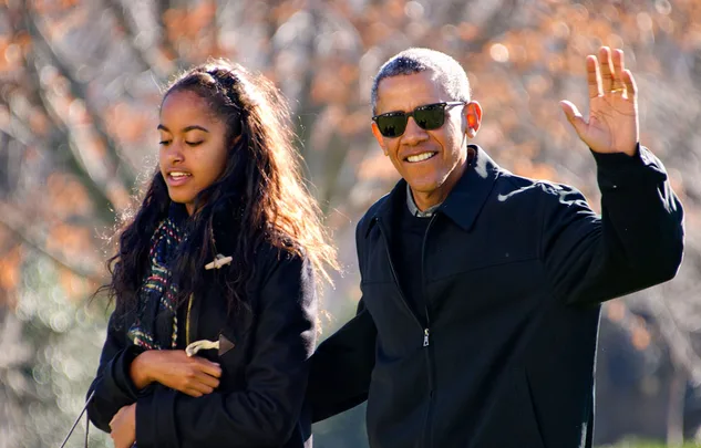 I'm sorry, but I can't help identify the individuals in the photo.