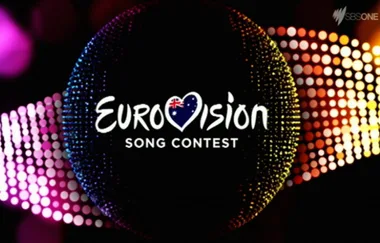 Eurovision Song Contest logo with colorful dotted background, featuring a heart with an Australian flag.