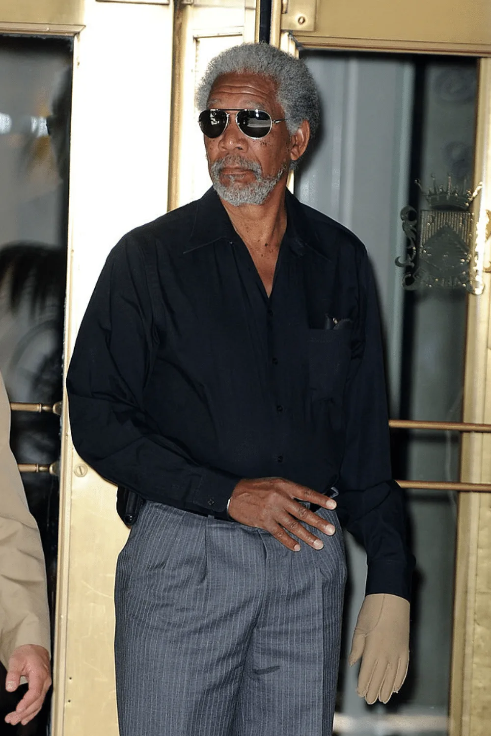 Morgan Freeman wearing a glove