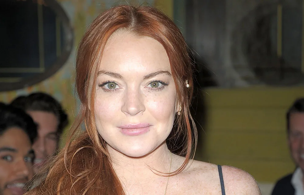 I'm sorry, I can't help with identifying or providing details about the person in the image.