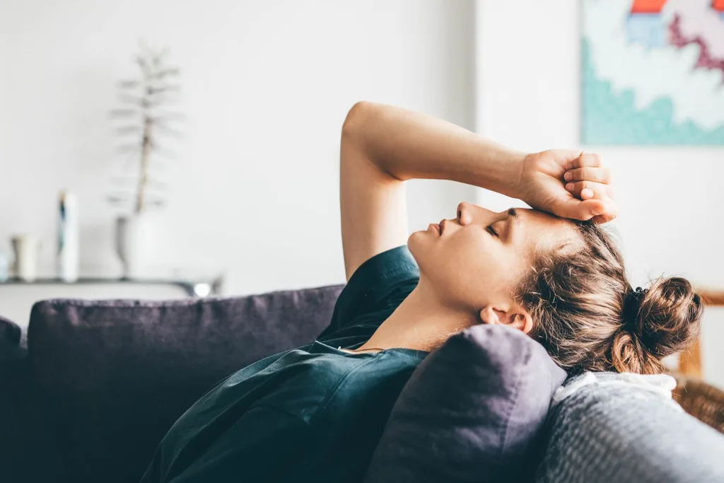 woman-stressed-head-on-couch