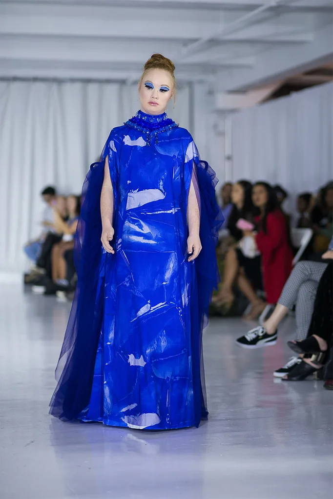 madeline-stuart-walking-a-catwalk-in-a-blue-gown