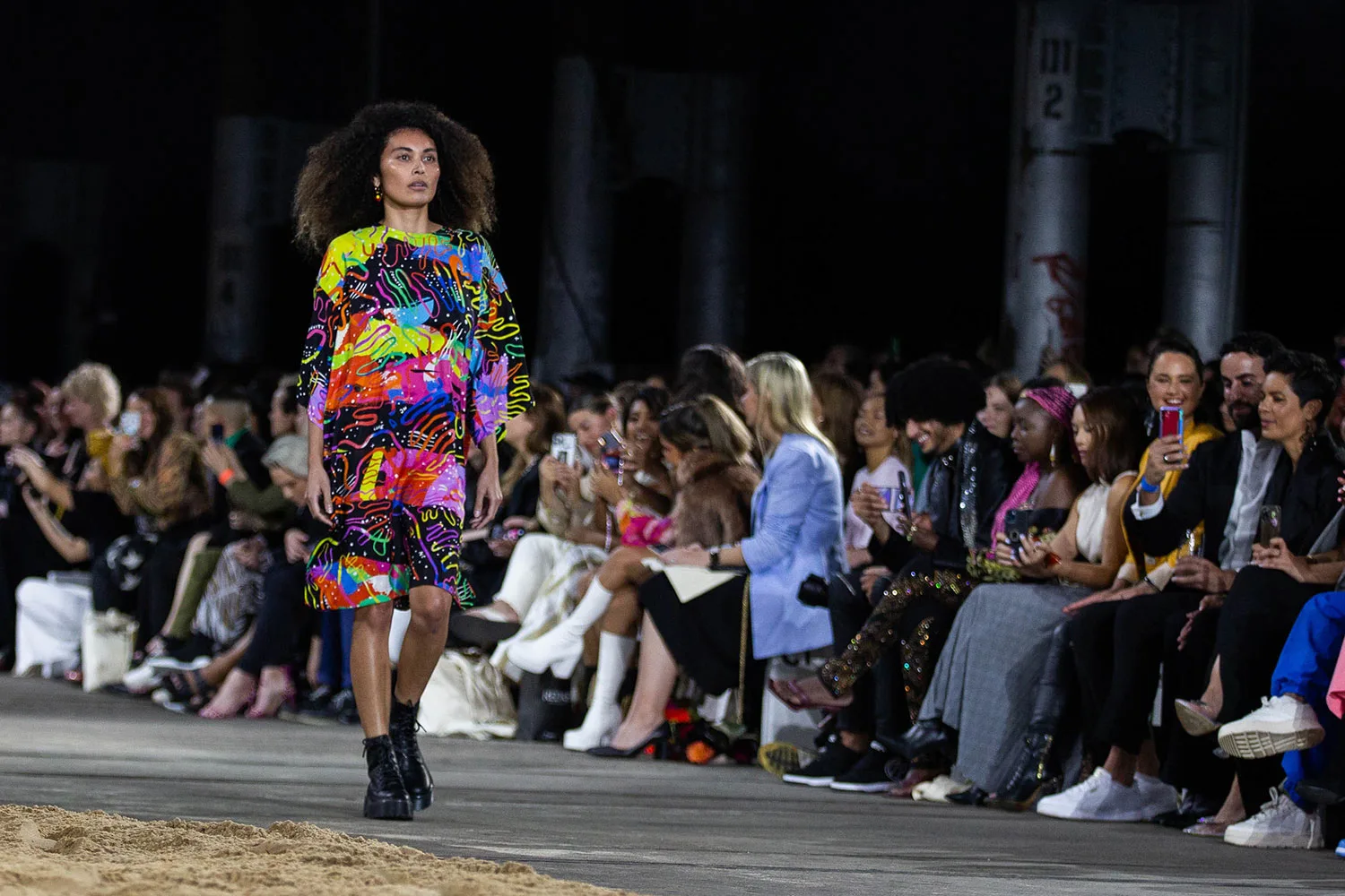 still-of-model-on-catwalk-in-colourful-patterned-dress