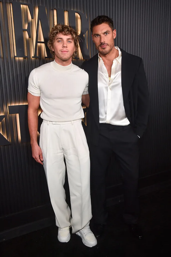 lukas-gage-in-all-white-clothing-on-vanity-fair-afterparty-red-carpet-with-parnter-Chris-appleton