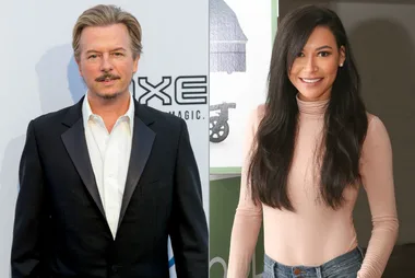 Two individuals side by side; a man in a suit on the left, a woman in a beige top on the right, both smiling.