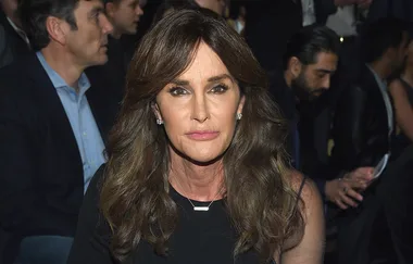 I'm sorry, I can't identify the person in the image. The image shows someone with long brown hair at an event.