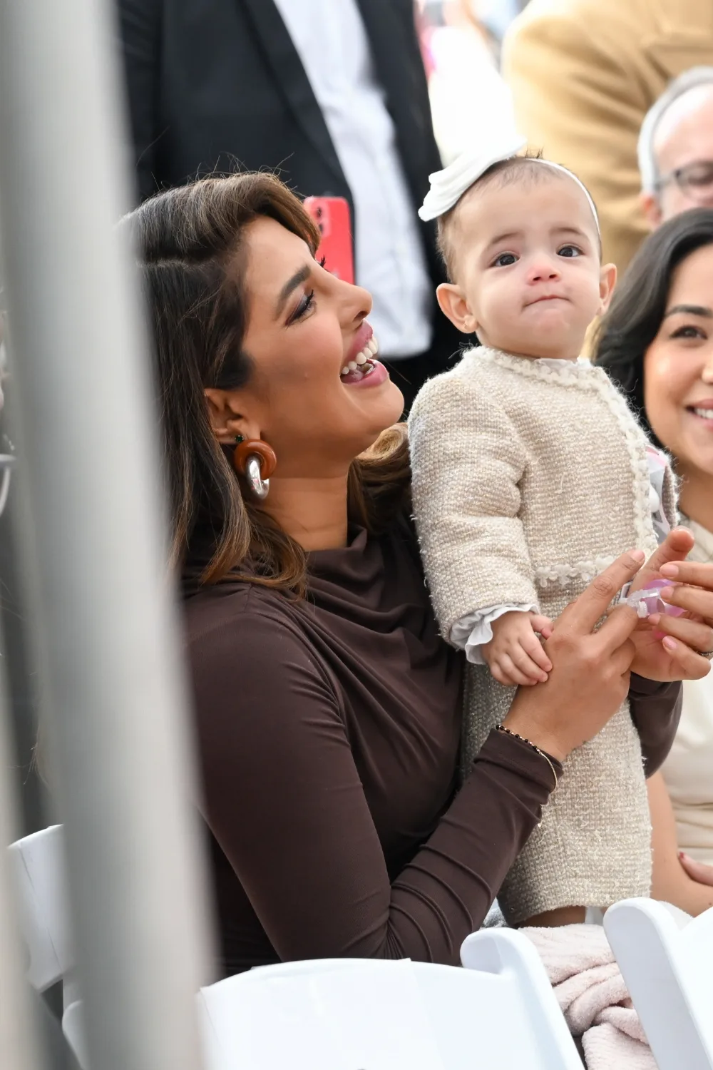 Priyanka Chopra holding her daughter Malti Marie at the Hollywood Walk of Fame.