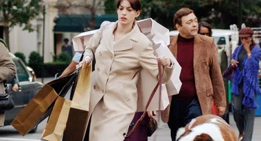 Lady with shopping bags, enjoying The Iconic’s Black Friday discounts.