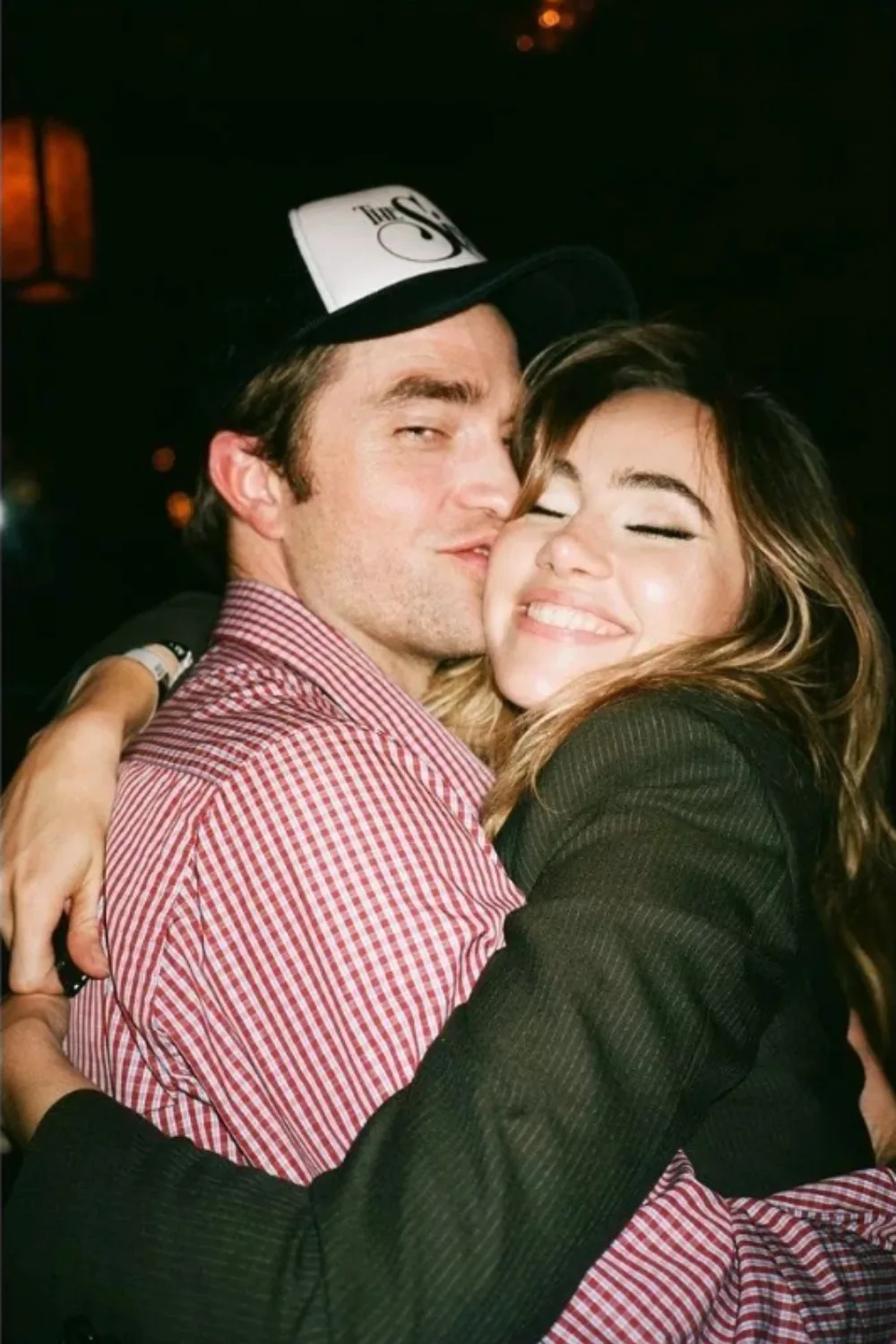 Robert Pattinson and Suki Waterhouse hugging.