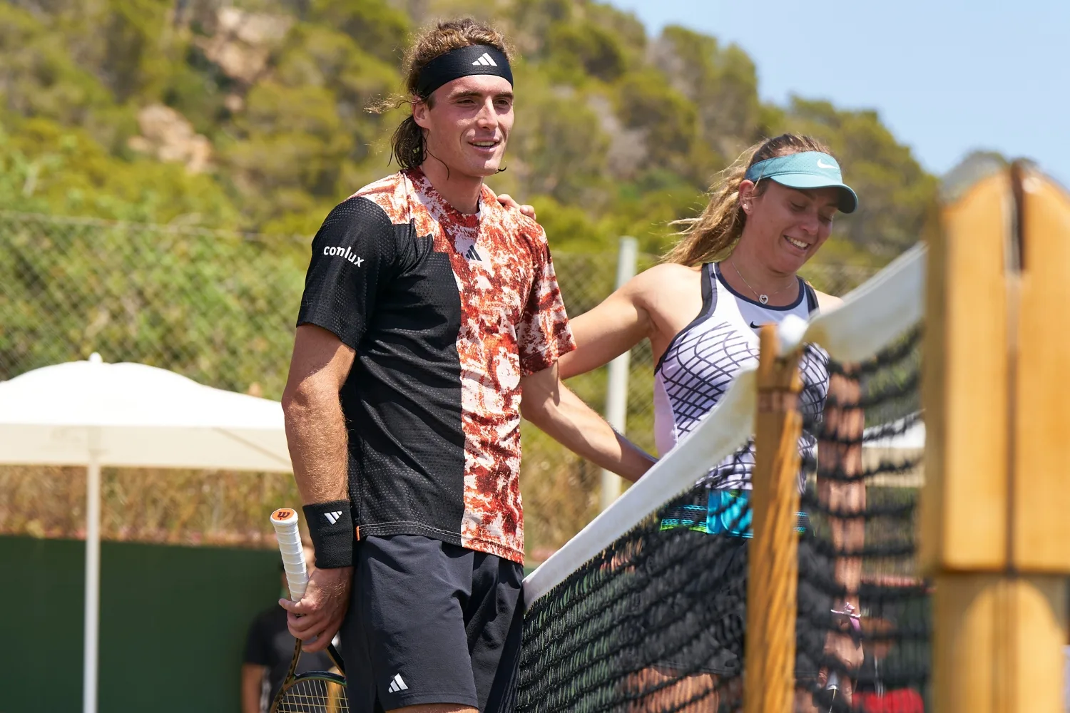 Stefanos Tsitsipas and girlfriend Paula Badosa playing tennis