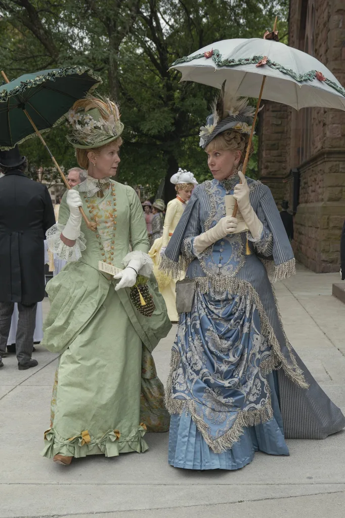 two women in 1890s period dress