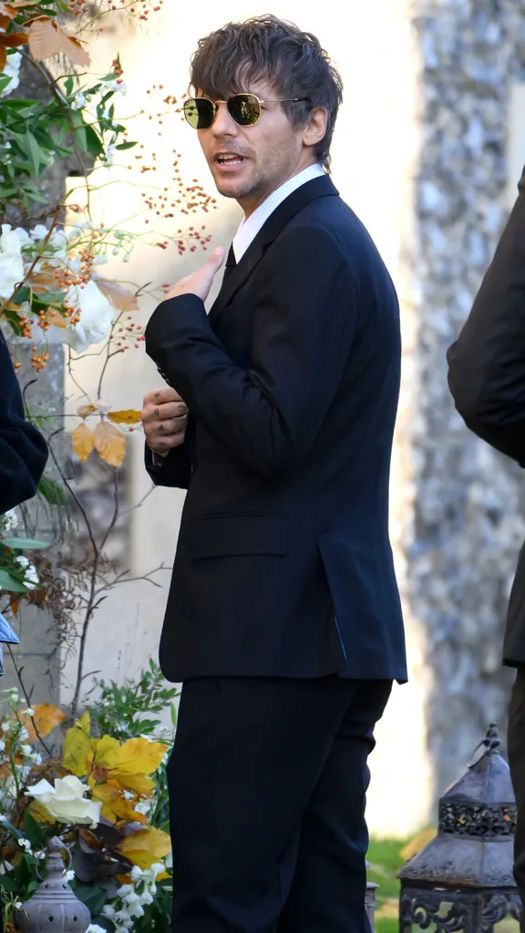 Louis Tomlinson attends the funeral for singer Liam Payne, former member of One Direction, on November 20, 2024 in Amersham, England. Former One Direction star Liam Payne's private funeral in Amersham has been widely anticipated to draw celebrities and fans alike, wishing to pay their final respects. The singer died after falling from a hotel balcony in Buenos Aires on October 16.