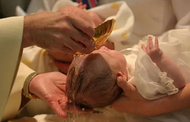 Watch this Priest slap baby in really disturbing baptism video