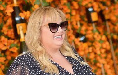 Rebel Wilson flaunts recent slim down in fitted red pencil skirt