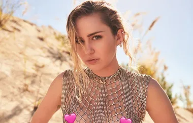 Miley Cyrus frees the nipple while explaining that she’s a ‘queer’ in a hetero relationship