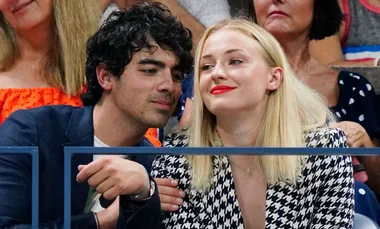 Sophie Turner chugged a glass of wine on a Jumbotron and the world can’t get enough
