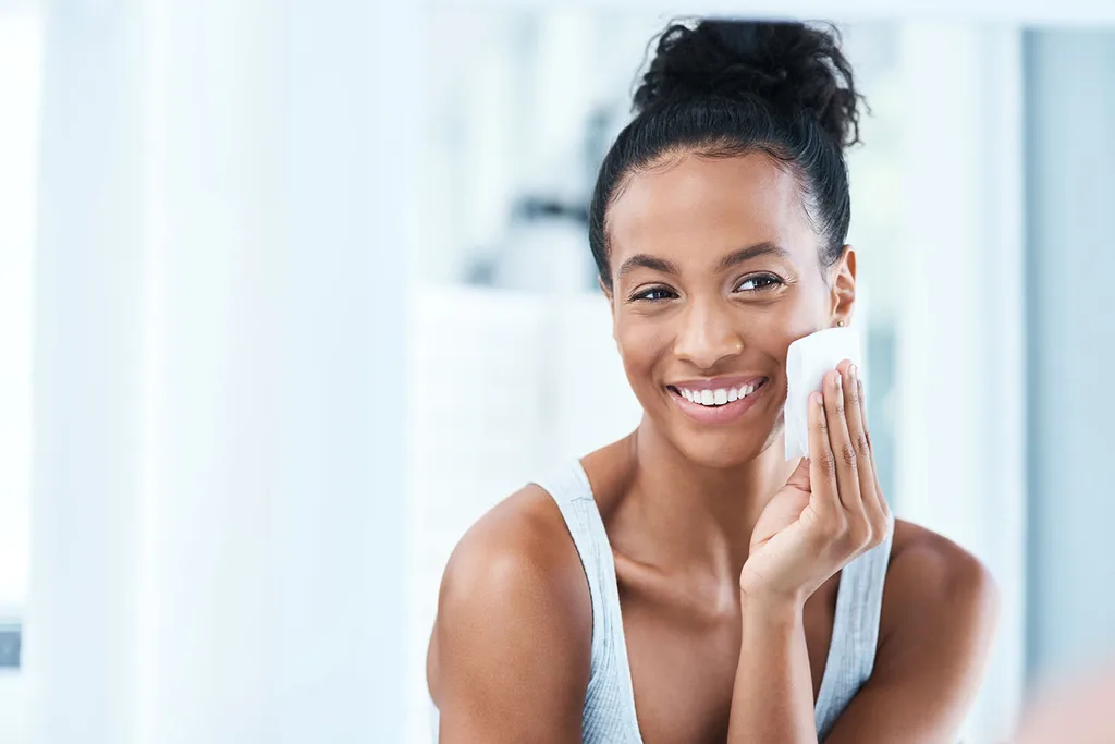 Girl cleansing face