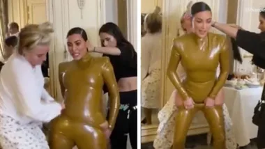Kim Kardashian struggles putting on latex outfit on KUWTK