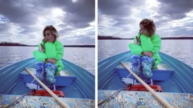 Hailey Bieber poses for hubby Justin as they row on a lake