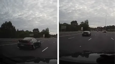 Black Porshe dangerously speeds past cars on Melbourne highway