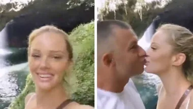 Jessika Power kisses James Brown during a hike before lockdown