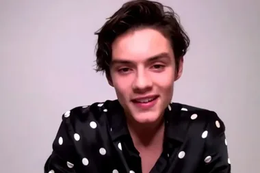 Louis Partridge says ‘Enola Holmes’ blew up while he was on the bus to school
