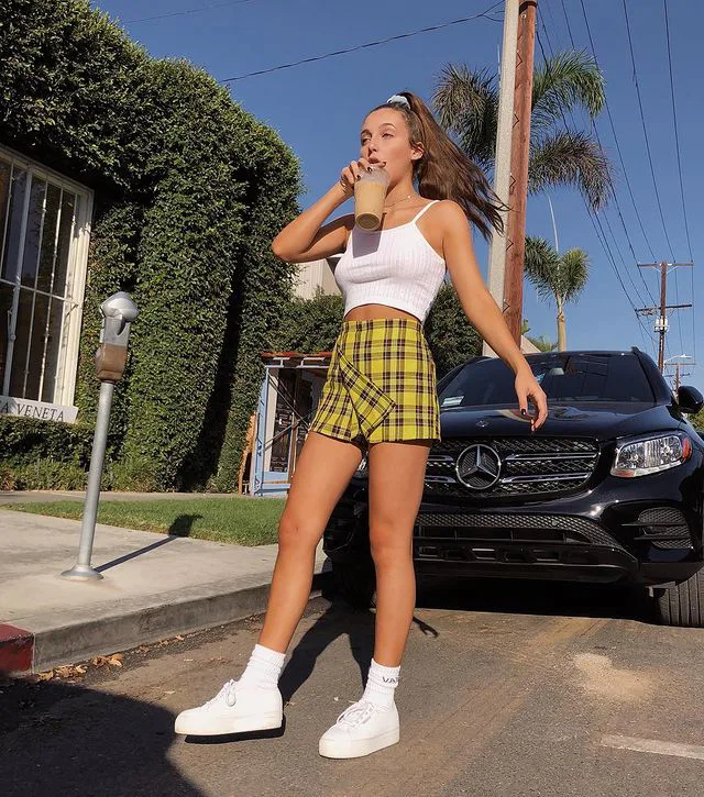 How To Dress Like Emma Chamberlain Style Crop Tops Denim Shorts Logo Looks Nike Air Force 1s More Girlfriend