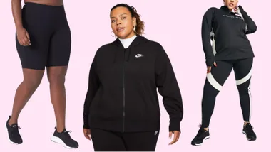 Three plus-size women modeling black activewear against a pink background.