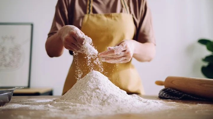 a woman cooking with flour