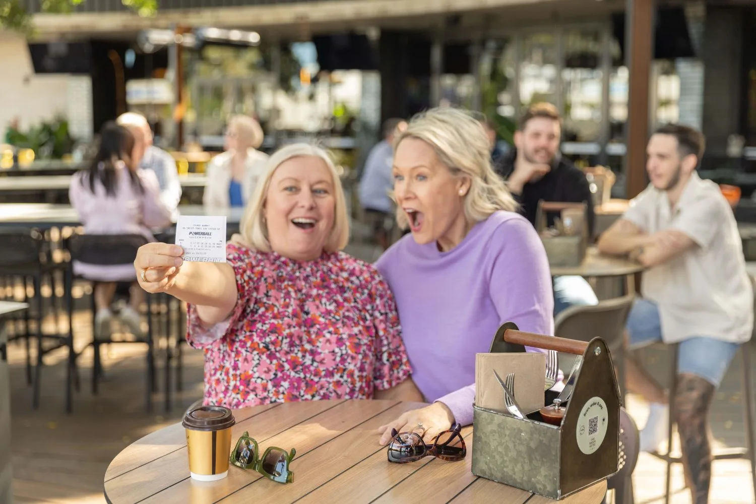 Two women celebrate winning Powerball
