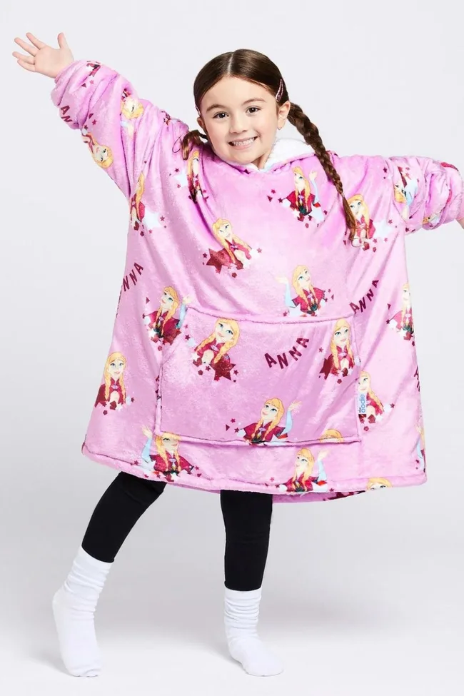 Child wearing a pink Oodie with "Anna" from Disney's Frozen, arms outstretched, smiling.