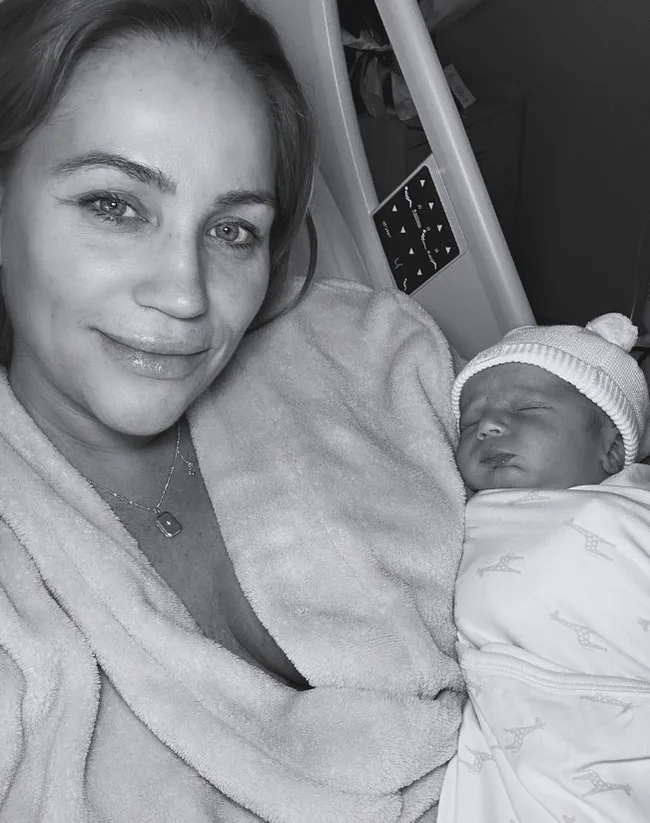 jules robinson holding her baby boy carter