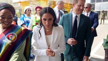 prince harry and meghan markle interacting during their nigeria visit